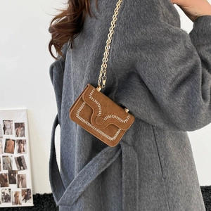 Brown suede mini crossbody bag with white leaf embroidery and fine gold chain strap