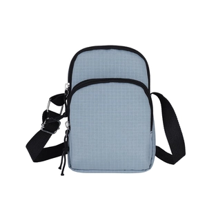 Minimalist light blue crossbody phone bag with black adjustable strap and dual zip pockets