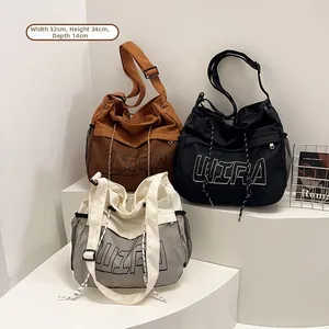 Three large canvas tote bags with ULTRA print and dimensions of 32x34x14cm in various colors