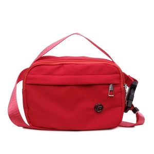 Minimalist red nylon crossbody bag with front zipper pocket and adjustable shoulder strap