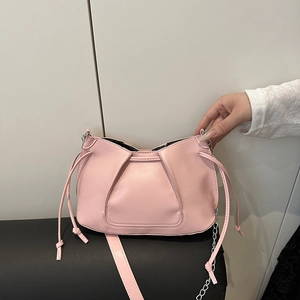 Light pink pleated shoulder bag with silver chain strap and drawstring accents