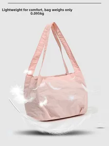 Detailed view of lightweight pink pleated bucket bag weighing only 0.095kg with feathers