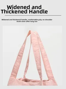 Close-up of widened and thickened pink tote bag shoulder straps for comfortable carrying