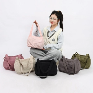 Minimalist large nylon bucket bag shown in six versatile colors for casual daily wear