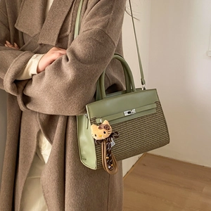 Retro style green leather and brown woven handbag with top handle and fine shoulder strap