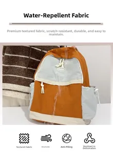 Detailed view of the water-resistant fabric and color-blocked design on the backpack