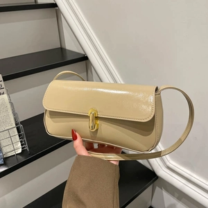 Minimalist beige glossy leather shoulder bag with elegant oval golden metal clasp
