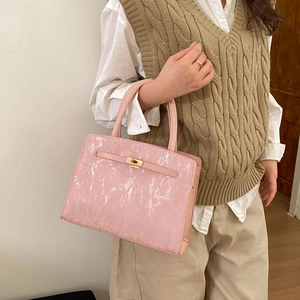 Pink marble pattern rectangular handbag with gold metal clasp and elegant handle
