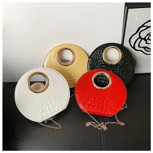 Detailed view of crocodile pattern semi-round handbags in four colors with gold handles