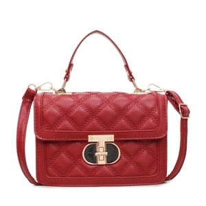 Red quilted crossbody bag with diamond stitching and gold T-lock hardware