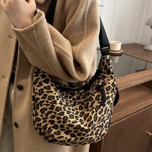 Leopard print canvas hobo crescent bag with black adjustable strap for winter fashion
