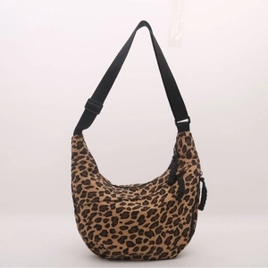 Stylish leopard print crescent crossbody bag with adjustable black shoulder strap and zipper