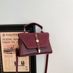 Minimalist burgundy crossbody bag with suede patchwork and golden metal hardware