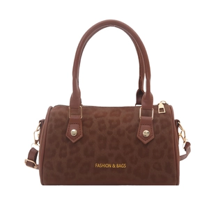 Retro leopard print boston bag with gold lettering and leather handles on white background
