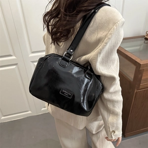 Retro black oil wax leather shoulder bag with large capacity and minimalist sleek design