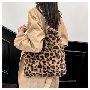 Detail shot of leopard print faux fur bucket bag with soft texture and slim shoulder strap