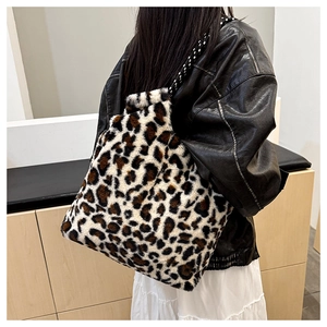 Close-up of leopard print faux fur tote bag with stylish black and white woven handles