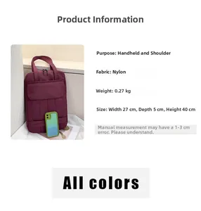 Detail of a lightweight purple nylon tote bag showing dimensions and smartphone for scale