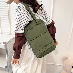 Army green vertical tote bag with front flap pocket for stylish daily commuting use