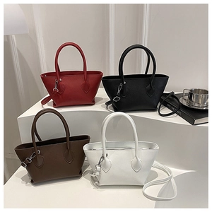 Detail showing high-quality lychee pattern leather bags in red, black, brown, and white colors
