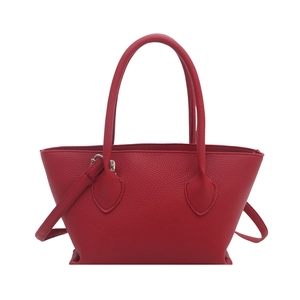 Classic red leather tote bag with top handles and adjustable shoulder strap for women