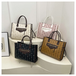 Detail of four colorful tote bags with retro diamond pattern and round top handles