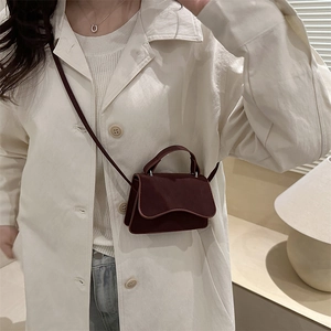 Mini vintage burgundy leather crossbody bag with top handle and elegant flap closure