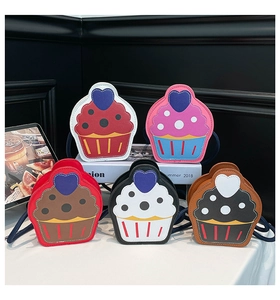Detail of colorful cupcake-shaped PU leather crossbody bags with heart and polka dot patterns
