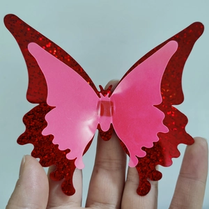 Macro view of double-layer luminous butterflies with red glitter for wall decoration