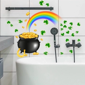 Detail of St. Patrick's Day window stickers with clover, rainbow, and pot of gold on tile