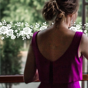 Magenta sleeveless V-back satin formal dress with elegant white floral vine decoration