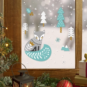 Close-up of Nordic style Easter bunny and egg static window stickers on a glass surface