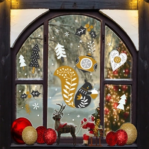 Detail of Nordic style squirrel and snowflake window stickers on glass for Easter decor