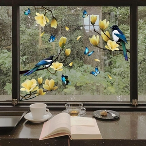 Floral and bird static window stickers featuring yellow magnolias and magpies on glass