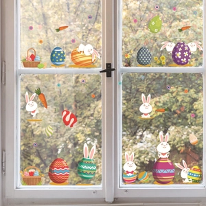 Stickers de Pâques statiques avec œufs colorés et lapins mignons sur vitre de fenêtre