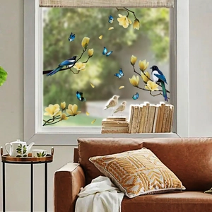 Floral static window stickers with magpies and yellow magnolias on glass in a living room