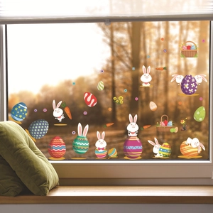 Stickers de Pâques avec lapins et œufs colorés sur une surface vitrée lumineuse