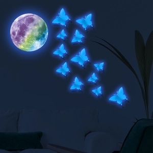 Luminous wall stickers featuring a rainbow moon and blue glowing butterflies for room decor