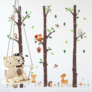 Detail of forest animal wall stickers with owls and squirrels on a clean white wall