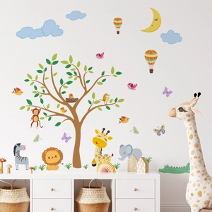 Close-up of cute cartoon forest animals and big tree wall stickers for nursery decor