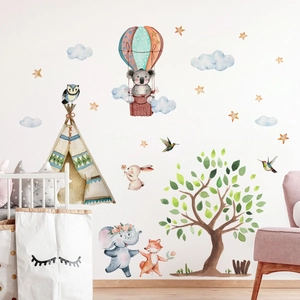 Watercolor cartoon elephant and balloon wall stickers shown in a nursery setting
