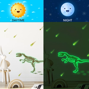 Luminous dinosaur skeleton and meteor wall decals showing day and night glow effects