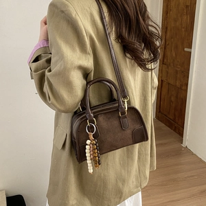 Vintage dark brown suede shoulder bag with beaded charm accessory for women
