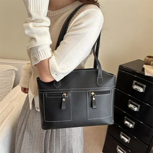 Chic black PU leather lunchbox tote with white stitching and front zipper pockets