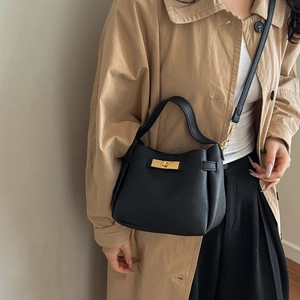 Minimalist black lychee texture leather handbag with gold lock and crossbody strap