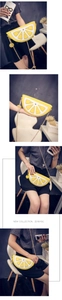 Detailed view of lemon shaped crossbody bag with gold chain strap and slice charm
