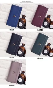 Detail of five colors of vintage long wallets with deer head emblem and white stitching