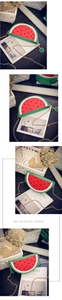 Close-up of creative watermelon shaped crossbody bag with red and green PU leather texture