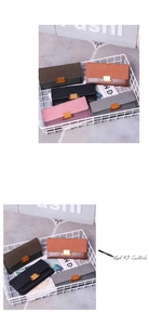 Detail of vintage matte leather wallets with modern gold rectangular metal clasps