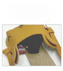 Detail view of mini yellow leather handbag showing interior capacity for small items